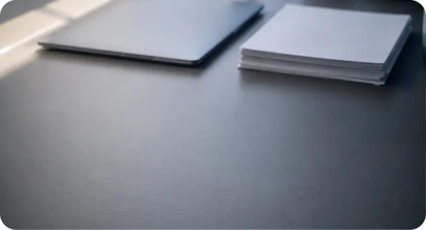 Laptop and documents on a desk