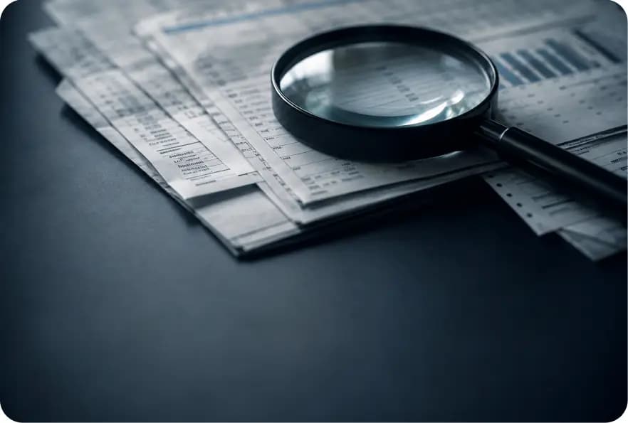 Magnifying glass over financial statements